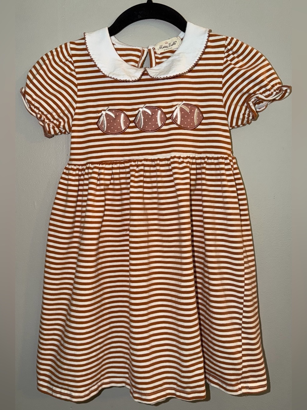 Brown and White striped football applique dress from Marie Nicole Clothing